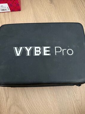 The VYBE Pro Percussion Massage Gun is a high-performance handheld device